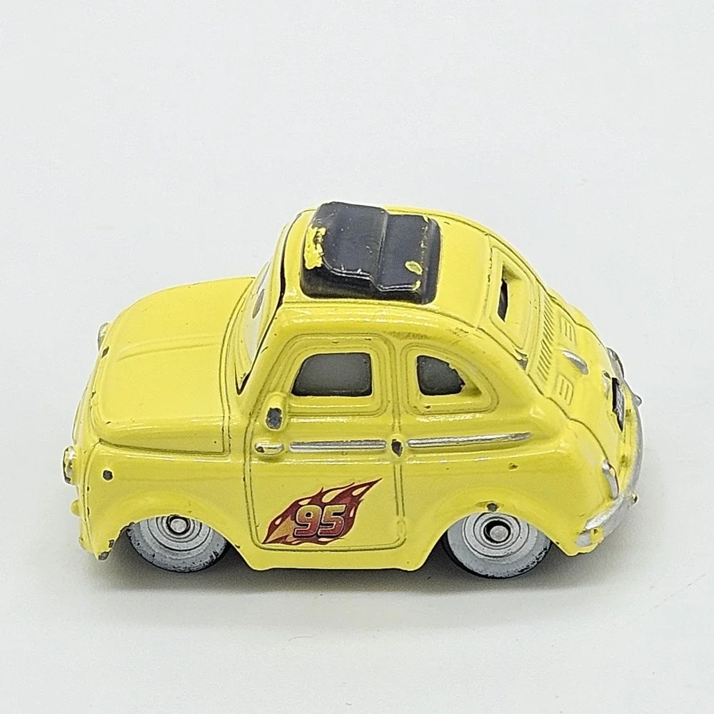 Disney Pixar Cars Luigi Yellow Diecast Car 95 Flame Side Toy Loose 2.5 Inch